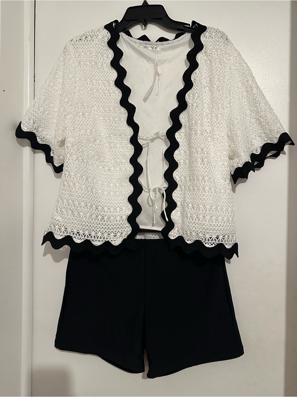 White short sleeve jacket  size L with black stretchy shorts size xl junior